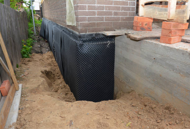 Happy homeowners after waterproofing job in Islandia